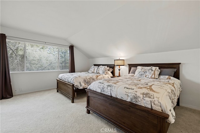 bedroom featuring light carpet and lofted ceiling