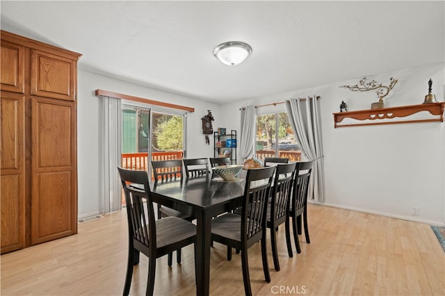 dining room with light wood-type flooring