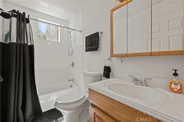 full bathroom featuring shower / bath combination with curtain, vanity, and toilet