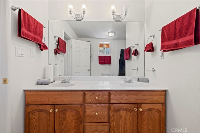 bathroom with vanity and a notable chandelier