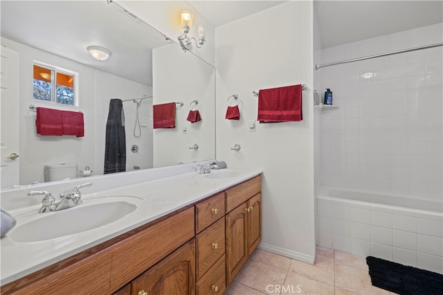 full bathroom featuring shower / bath combo with shower curtain, tile patterned floors, vanity, and toilet