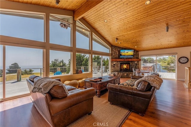 living room with hardwood / wood-style floors, a fireplace, wooden ceiling, and high vaulted ceiling