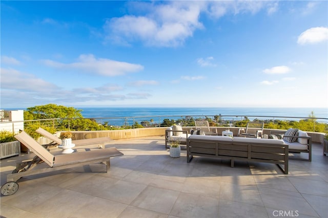 view of patio featuring an outdoor living space and a water view