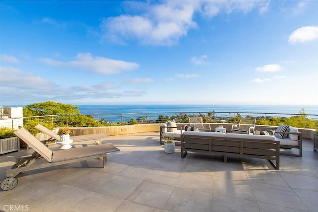 view of patio featuring outdoor lounge area and a water view