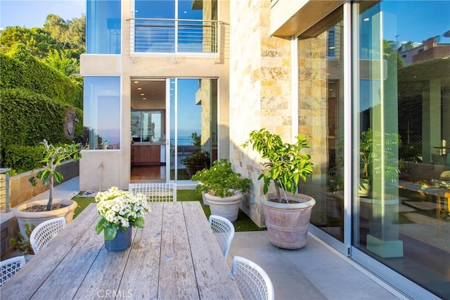 view of patio featuring a balcony