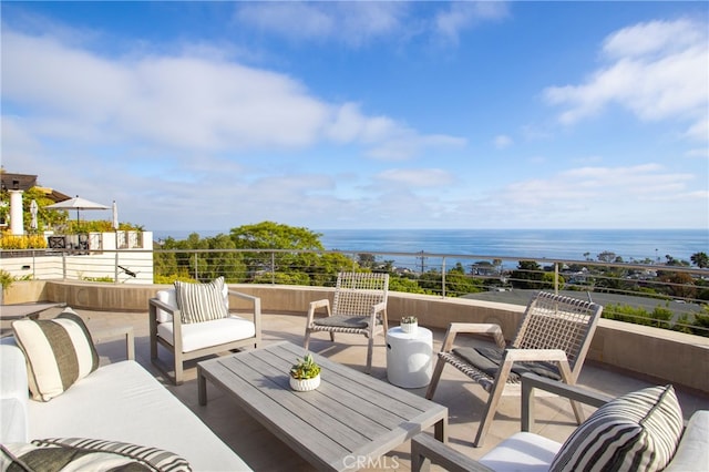 exterior space featuring an outdoor living space and a water view