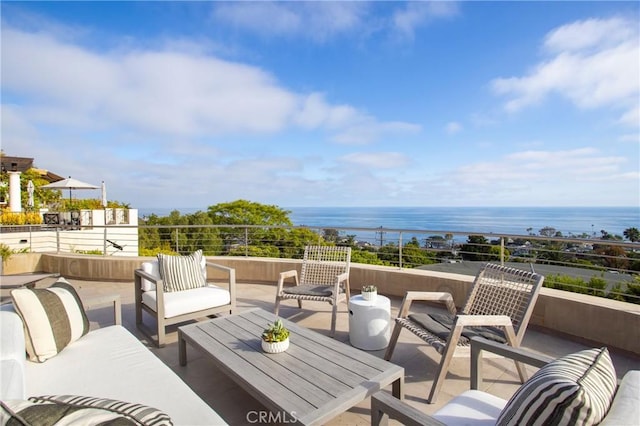 view of patio featuring outdoor lounge area and a water view