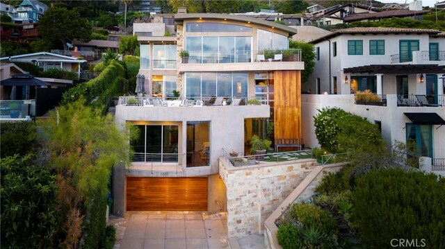 back of house with a garage