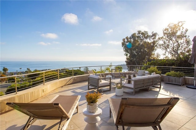 view of patio / terrace featuring a water view and outdoor lounge area