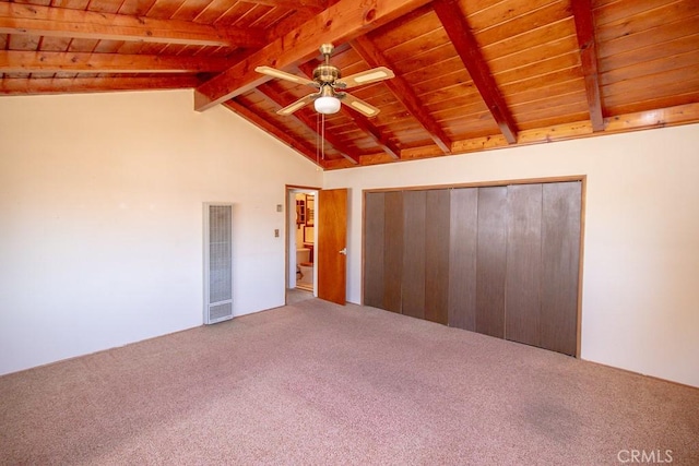 unfurnished bedroom with wooden ceiling, carpet floors, a ceiling fan, vaulted ceiling with beams, and visible vents