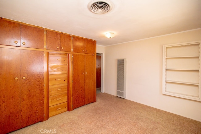 unfurnished bedroom featuring light colored carpet and ornamental molding