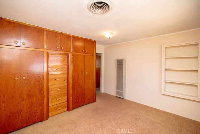 unfurnished bedroom featuring light carpet, visible vents, and ornamental molding