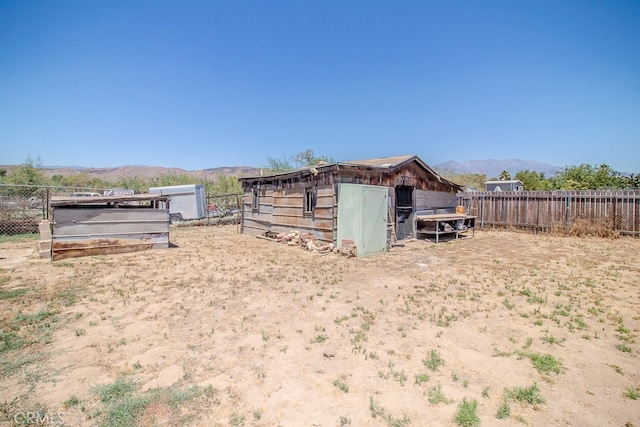 exterior space featuring an outbuilding and a mountain view