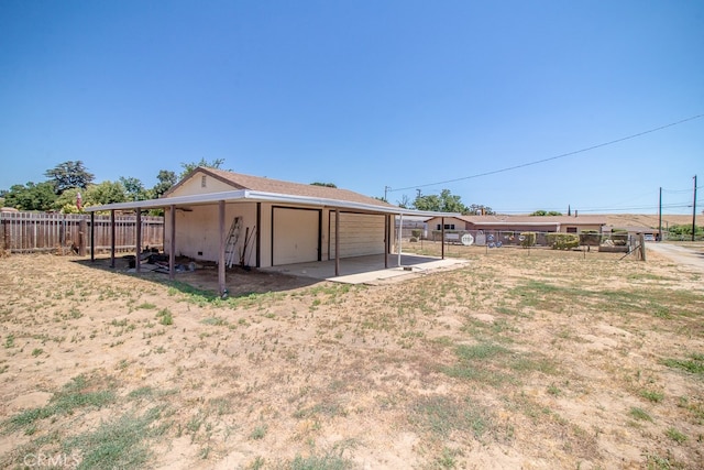 view of yard featuring an outbuilding and a garage