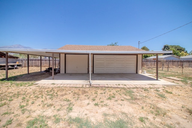 garage featuring a carport