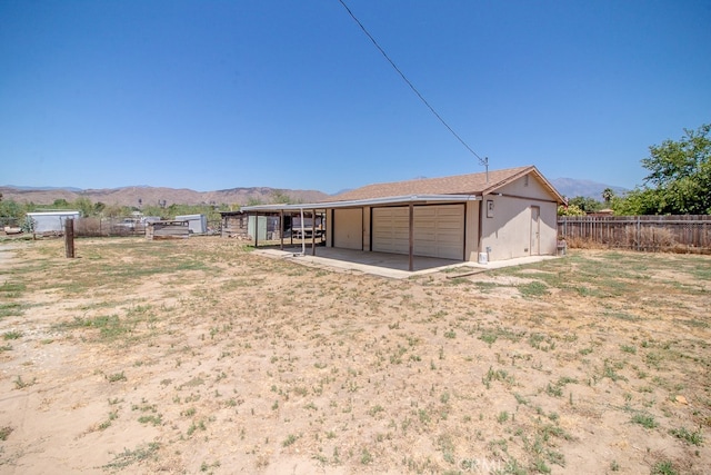 back of property featuring a mountain view