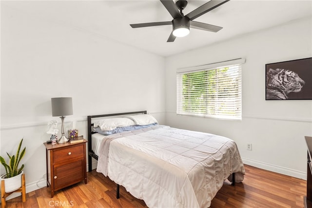 bedroom featuring ceiling fan and light wood-type flooring