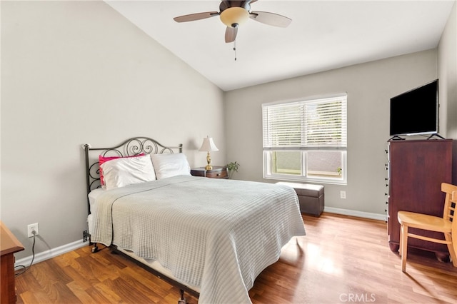 bedroom with wood-type flooring, lofted ceiling, and ceiling fan