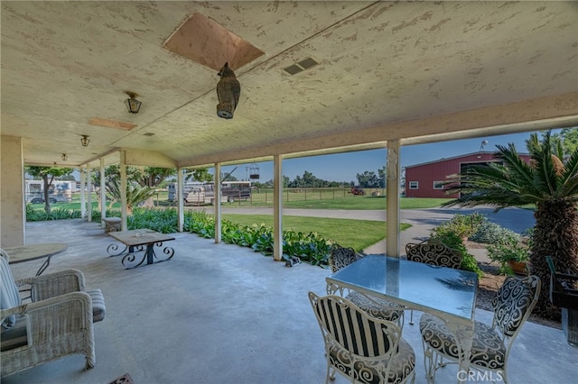 view of patio featuring ceiling fan