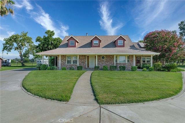 view of front facade with covered porch and a front yard