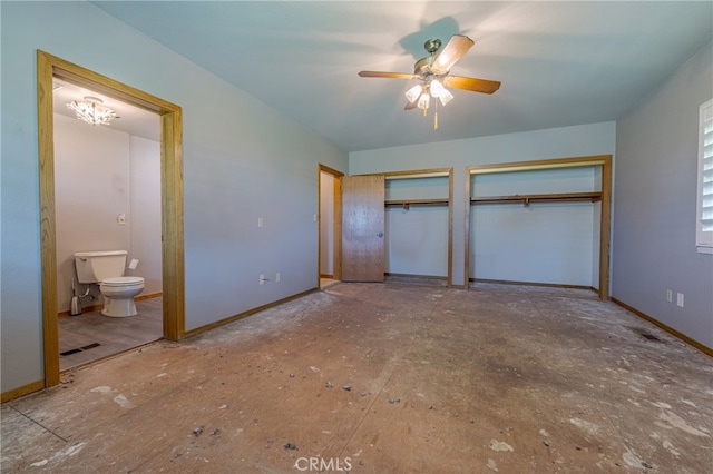 unfurnished bedroom featuring ceiling fan, two closets, and ensuite bath