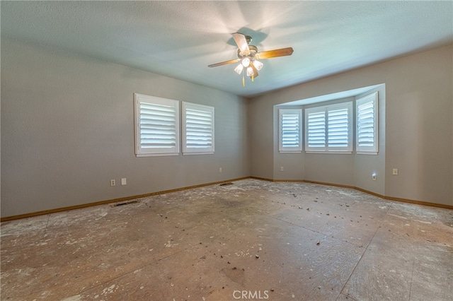 unfurnished room with a textured ceiling and ceiling fan