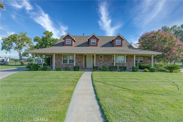 view of front of property featuring a porch and a front lawn