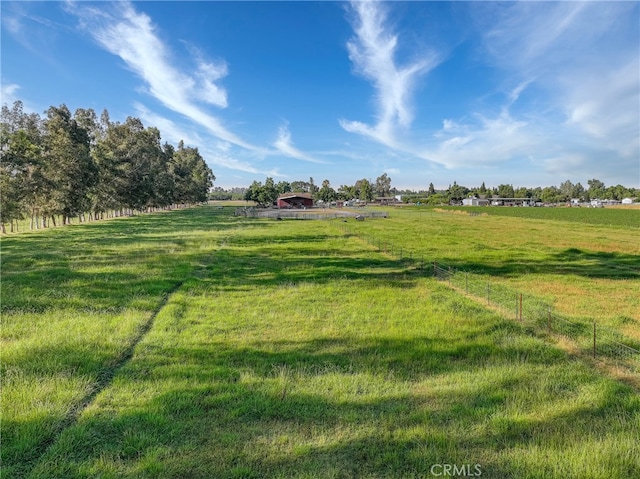 view of yard with a rural view