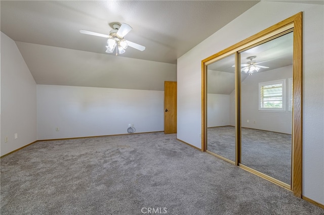 additional living space with carpet, ceiling fan, and vaulted ceiling