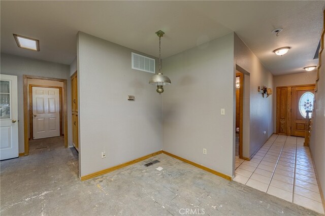 foyer entrance with light tile patterned flooring