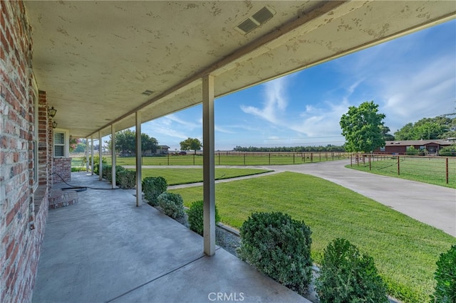 view of patio / terrace featuring a rural view