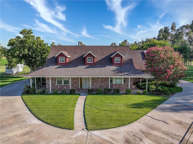 new england style home with a front yard