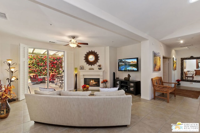 tiled living room featuring ceiling fan