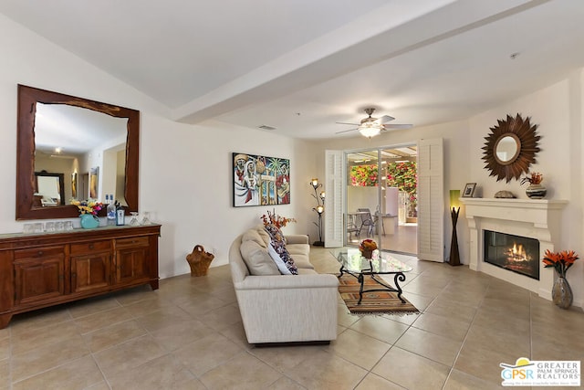 tiled living room featuring ceiling fan