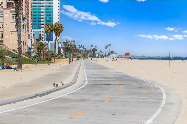 view of road with sidewalks and curbs