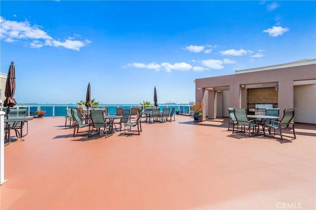 view of patio with a water view