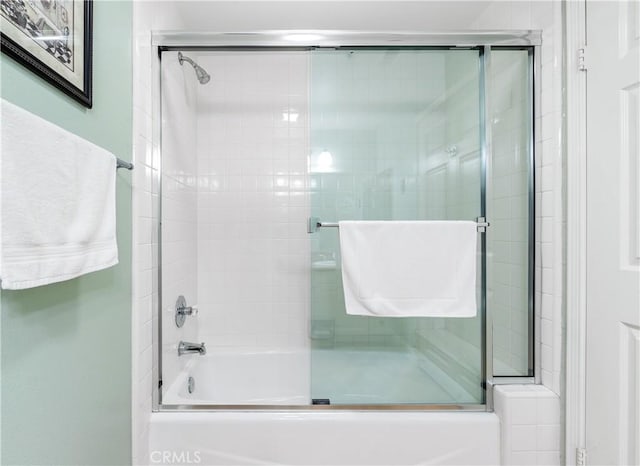 full bathroom featuring shower / bath combination with glass door