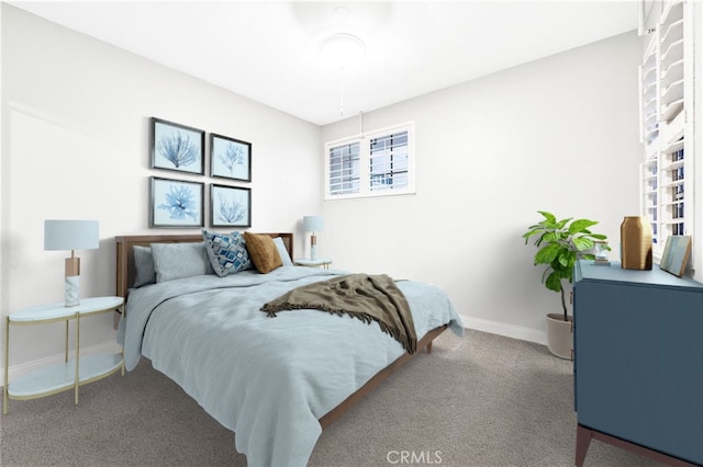 carpeted bedroom with baseboards