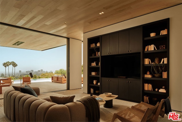 carpeted living room with wood ceiling and built in features