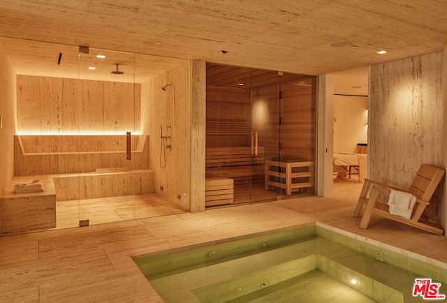 view of sauna / steam room featuring wood ceiling, wood walls, and hardwood / wood-style floors