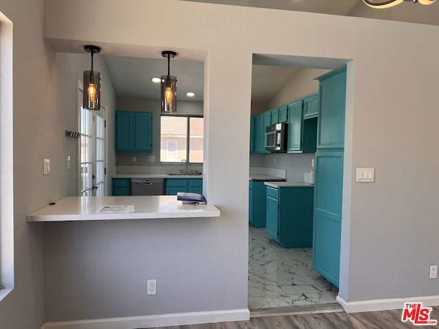 kitchen featuring hanging light fixtures, dishwasher, sink, and kitchen peninsula