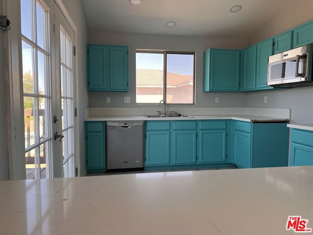 kitchen featuring stainless steel appliances, sink, and plenty of natural light