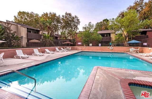 view of pool featuring a patio