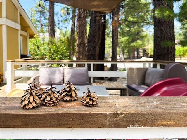 wooden deck with outdoor lounge area