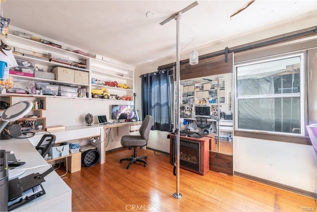 home office with wood-type flooring