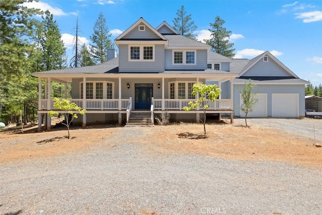 view of front facade with a porch and a garage