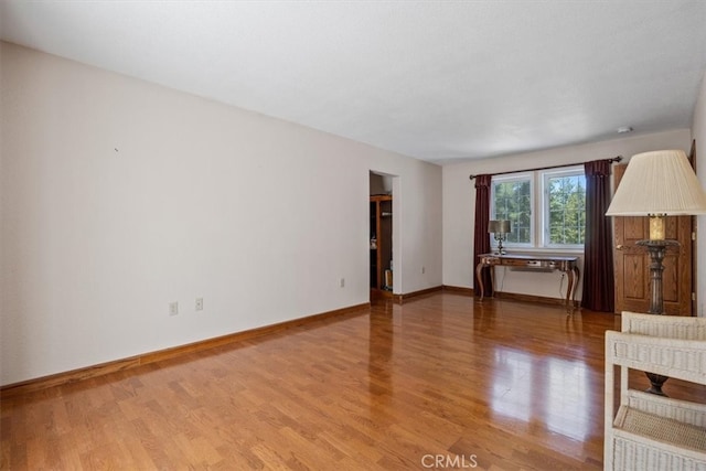 unfurnished living room with wood-type flooring