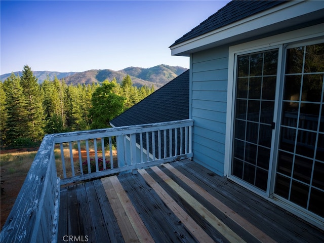 wooden deck featuring a mountain view