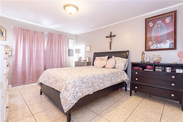 bedroom with light tile patterned floors and crown molding