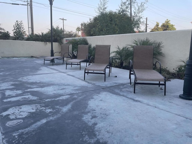 view of patio terrace at dusk